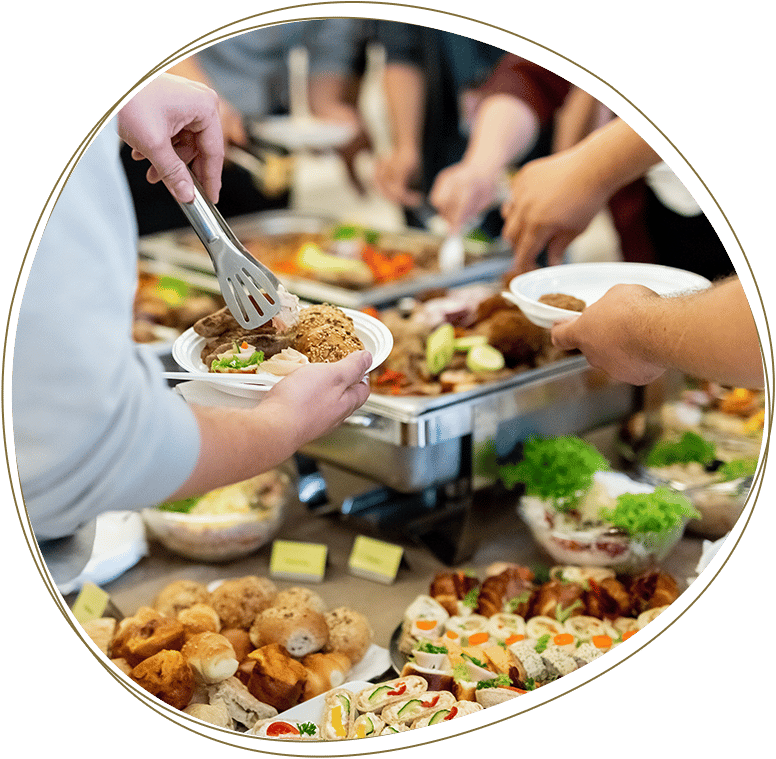 Close up of people serving themselves with canapes in buffet of restaurant.