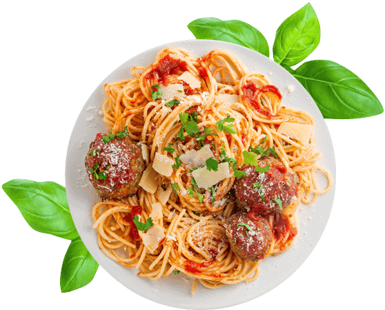Spaghetti on white plate with fresh green herb